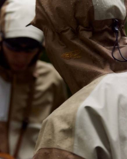 A close-up of a person wearing a raincoatDescription automatically generated